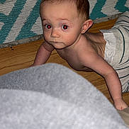 Ryder is registered to the contest to win money with this photo: baby, babycrawling, blanket, bodypart, clothing, crawling, face, finger, hand, happy, head, homedecor, newborn, pants, person, photography, portrait, quilt, smile, wood