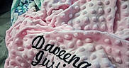 Daveena is registered to the contest to win money with this photo: newborn, baby, blanket, pink_blanket, embroidered_text, sleeping, bed, cozy, soft_texture, infant, wrapped, person, cute, resting, fabric, textile, indoor, portrait, peaceful, child