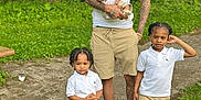 Jaciere is registered to the contest to win money with this photo: adult, baby, child, dad, family, forest, grass, matching_outfits, nature, outdoor, park, people, person, portrait, shorts, sneakers, standing, trees, white_polo, young_children