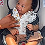 baby, child, car_seat, smiling, hand, infant, clothing, shorts, shirt, sitting, safety_belt, cute, happy, indoor, portrait, light, skin, fingers, feet, seat