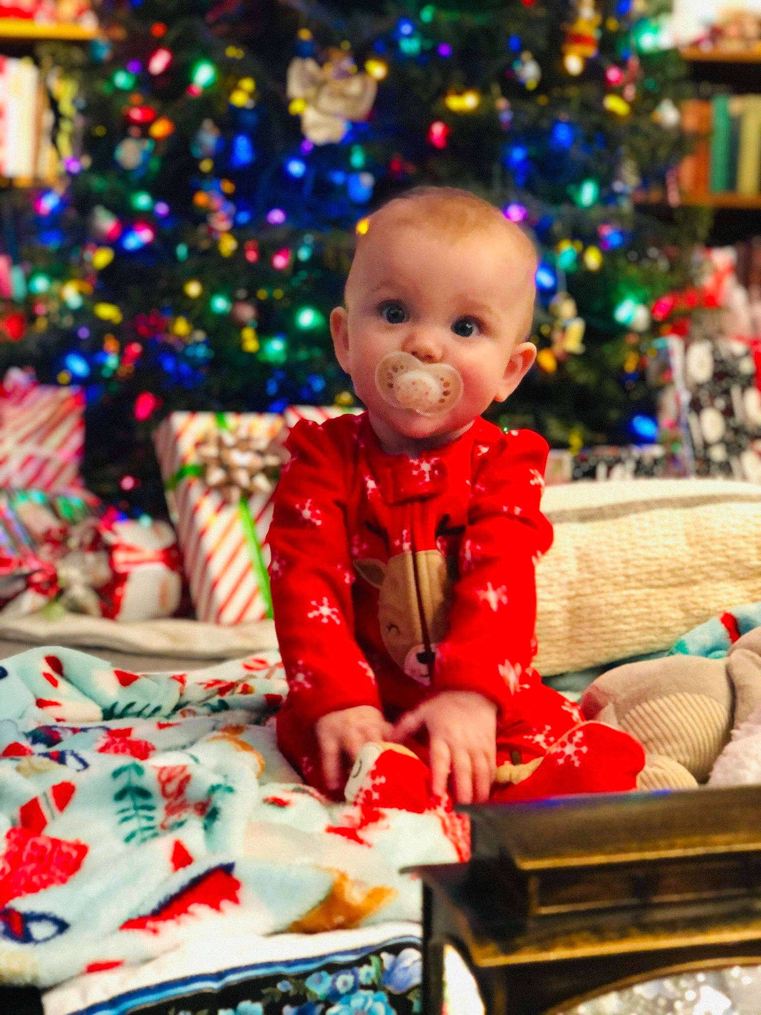 Jazmine joined the competition — help win amazing prizes! baby, baby_toddler_clothing, child, christmas, christmas_decoration, christmas_eve, christmas_lights, christmas_ornament, christmas_tree, event, holiday, holiday_ornament, home, human, interior_design, living_room, mouth, ornament, person, sitting