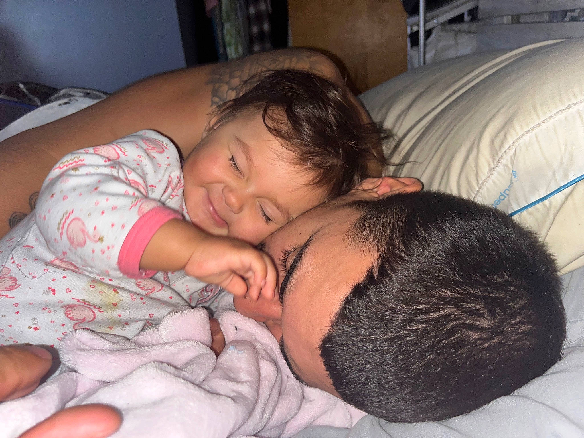 Aida is registered to the contest to win money with this photo: abdomen, baby, bed, black_hair, cheek, chest, comfort, finger, fun, gesture, hairstyle, happy, human_body, mammal, mouth, nose, person, skin, toddler, trunk