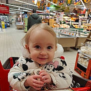 Kassia participe au concours pour gagner de l'argent avec cette photo : child, baby, toddler, smiling, shopping_cart, supermarket, grocery_store, jacket, mickey_mouse, keys, shopping_cart_seat, portrait, cute, happy, indoor, aisle, produce_section, blonde_hair, retail, parenting
