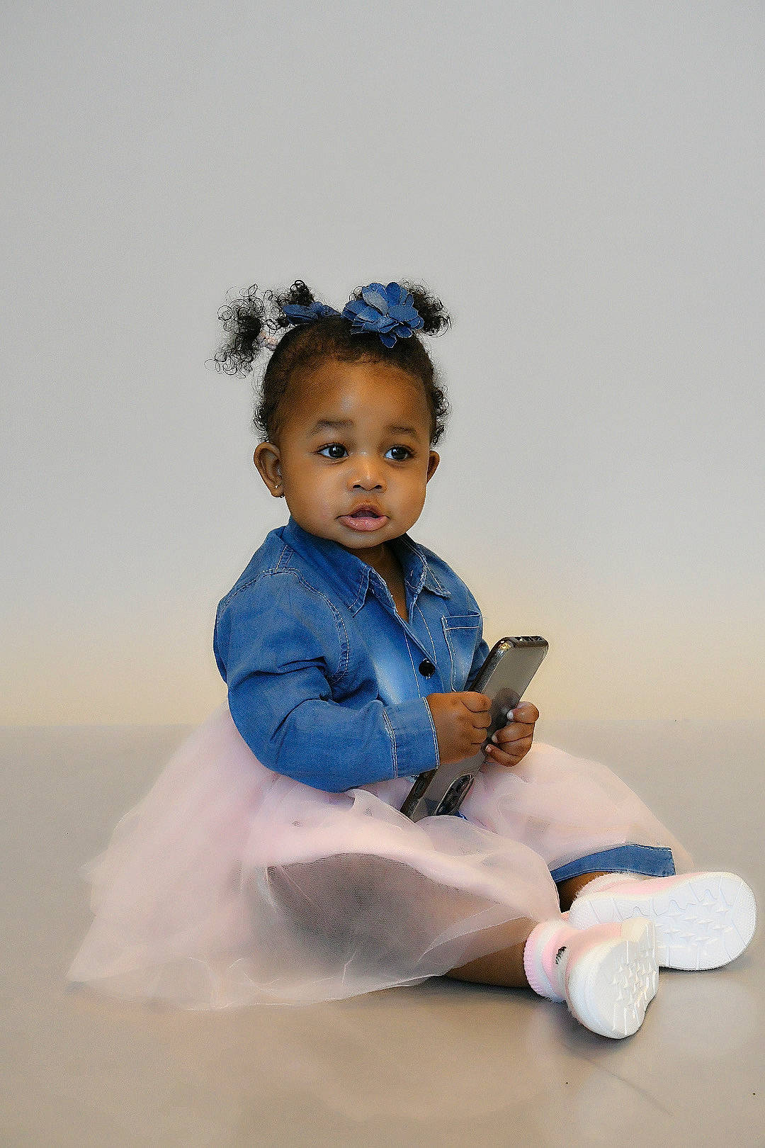 Zanai is registered to the contest to win money with this photo: baby, baby_toddler_clothing, child, costume, electric_blue, fashion_accessory, flash_photography, formal_wear, fun, gesture, happy, headpiece, human_leg, jewellery, person, photo_shoot, portrait_photography, sitting, sleeve, sock