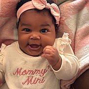 Mikiya joined the competition — help win amazing prizes! baby, infant, smiling, headband, pink, sweater, text, blanket, cozy, cute, child, portrait, happy, indoors, closeup, person, soft, warm_colors, clothing, newborn