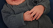 Terrence joined the competition — help win amazing prizes! baby, babylaughing, bodypart, clothing, coat, face, finger, hand, happy, head, knitwear, longsleeve, newborn, pants, person, photography, portrait, sleeve, smile, sweater
