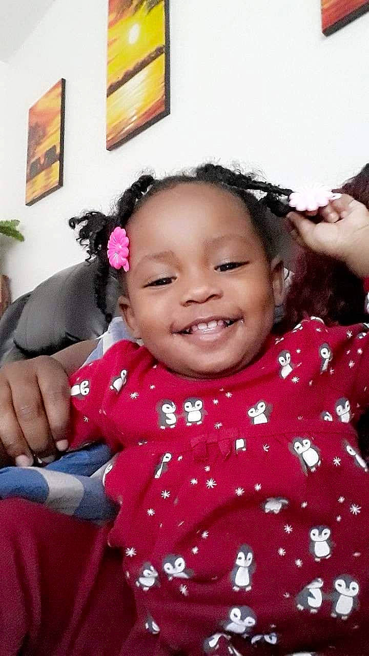 Miss A'Dah is registered to the contest to win money with this photo: baby, black_hair, cheek, child, ear, face, facial_expression, forehead, fun, hair, hairstyle, happy, head, joy, laugh, lip, nose, person, pink, skin