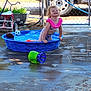 backyard, blue, child, concrete, curly_hair, fence, happy, outdoor, pink, play, pool, soccer_ball, summer, sunlight, swimsuit, toddler, toy, tricycle, vehicle, water