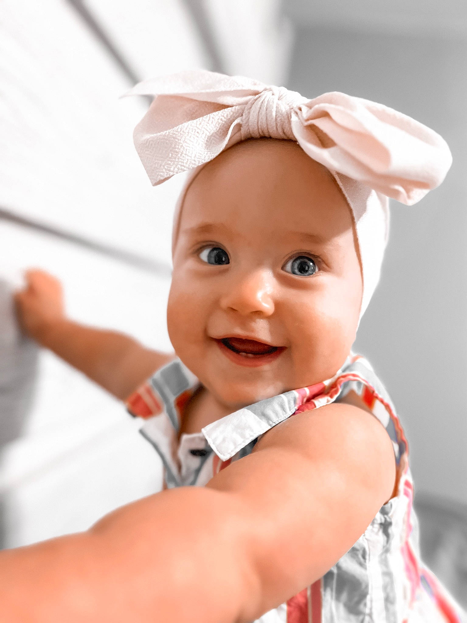 Evelyn is registered to the contest to win money with this photo: baby, baby_products, baby_toddler_clothing, child, chin, eye, fashion_accessory, finger, fun, gesture, hair_accessory, happy, headband, headgear, headpiece, headwear, joy, magenta, person, pink