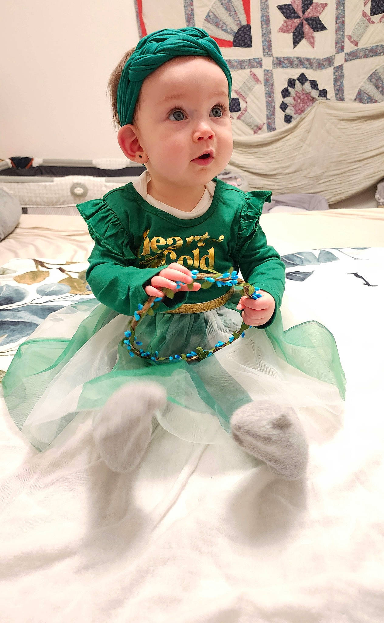 Serenity is registered to the contest to win money with this photo: baby, baby_toddler_clothing, cap, child, costume, costume_hat, event, face, fashion_accessory, fun, happy, headband, headwear, jewellery, linens, pattern, person, sitting, sleeve, sock