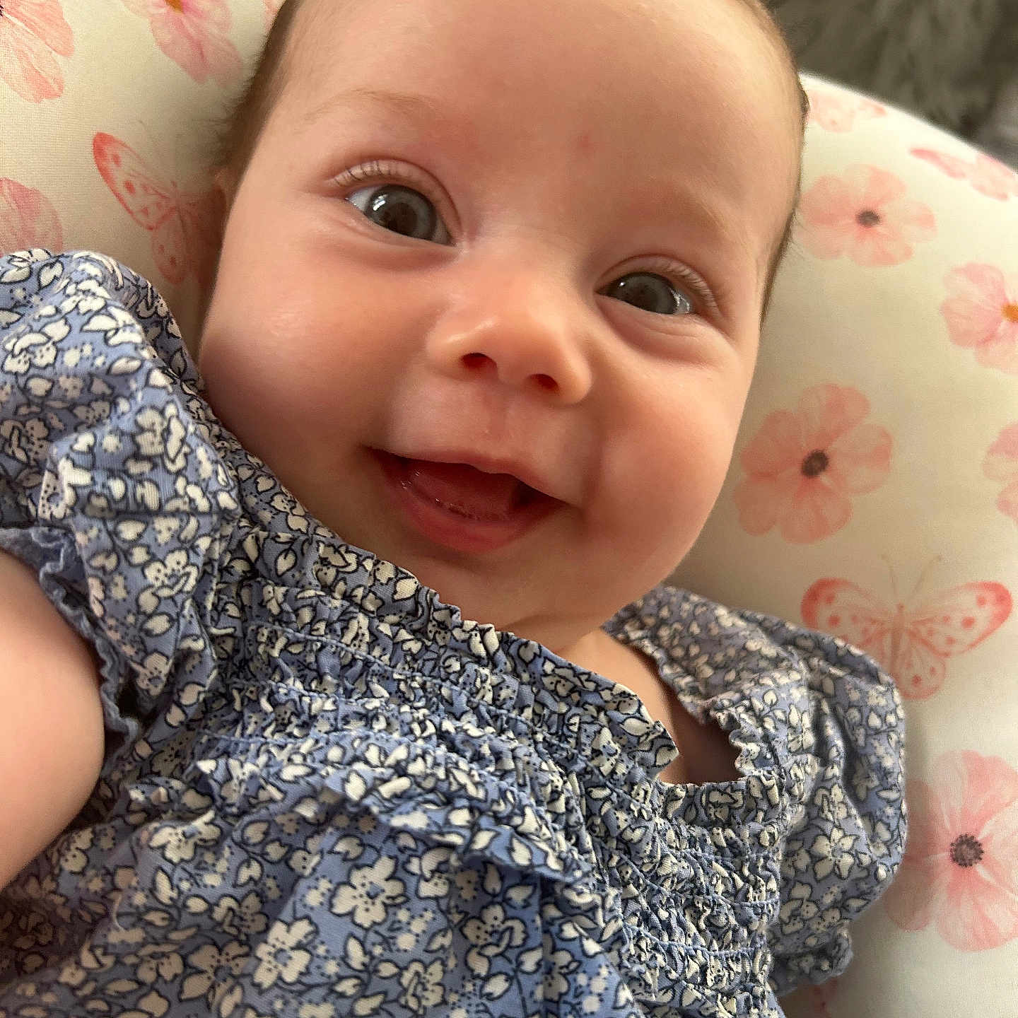 Azrael is registered to the contest to win money with this photo: baby, babylaughing, blouse, clothing, cushion, dress, face, happy, head, homedecor, laughing, newborn, person, photography, portrait, selfie, smile