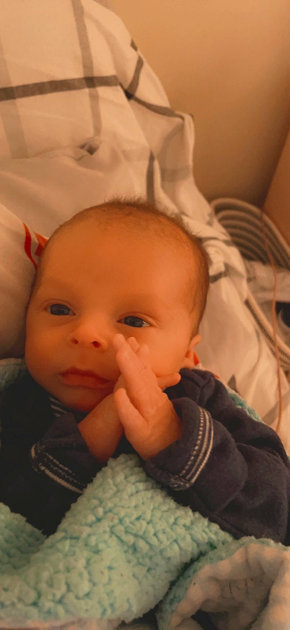 Calvin is registered to the contest to win money with this photo: baby, baby_toddler_clothing, cheek, chin, comfort, ear, eyebrow, eyelash, forehead, gesture, head, iris, lip, mouth, nose, person, skin, smile, textile, thumb