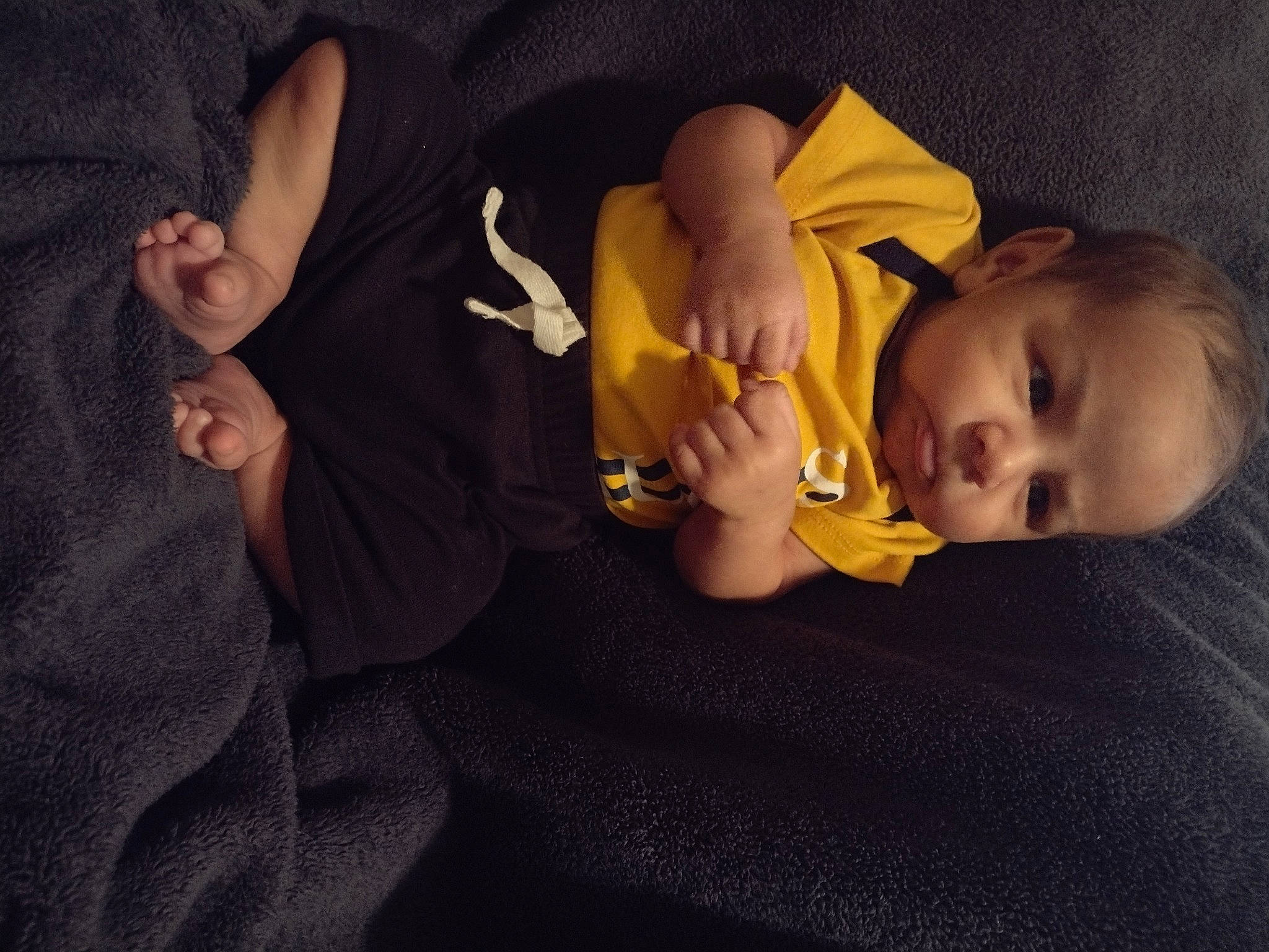 Ezekiel is registered to the contest to win money with this photo: baby, baby_toddler_clothing, cheek, comfort, elbow, finger, fun, gesture, hand, happy, human_leg, iris, mouth, nail, nose, person, sleeve, thigh, thumb, toddler