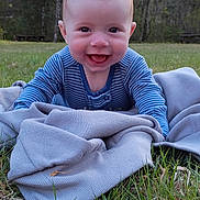 Archer joined the competition — help win amazing prizes! baby, blanket, blue_striped_onesie, cute, daylight, early_spring, face, grass, happy, head, infant, leafless_tree, nature, outdoor, person, playtime, smiling, toddler, tree, young_child