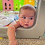 Eden joined the competition — help win amazing prizes! baby, infant, playpen, carpet, colorful, curious, child, arm, face, indoor, toy, soft_lighting, expression, candid, skin, head, cheek, floor, furniture, play_area