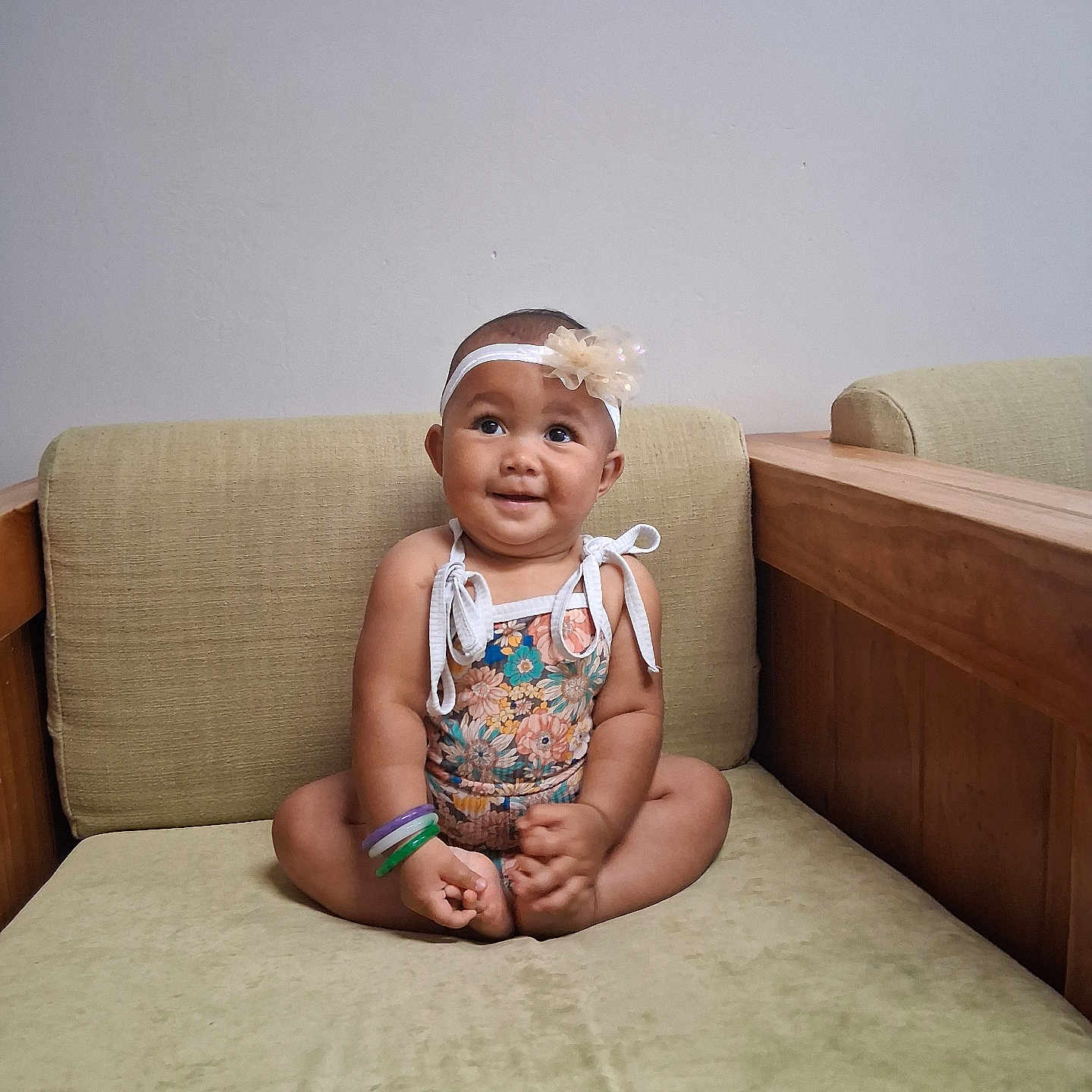 Kaimani joined the competition — help win amazing prizes! arm, baby, bracelets, child, cross_legged, cute, floral_outfit, flower_headband, foot, furniture, happy, headband, indoor, infant, person, portrait, seated, skin, smile, sofa
