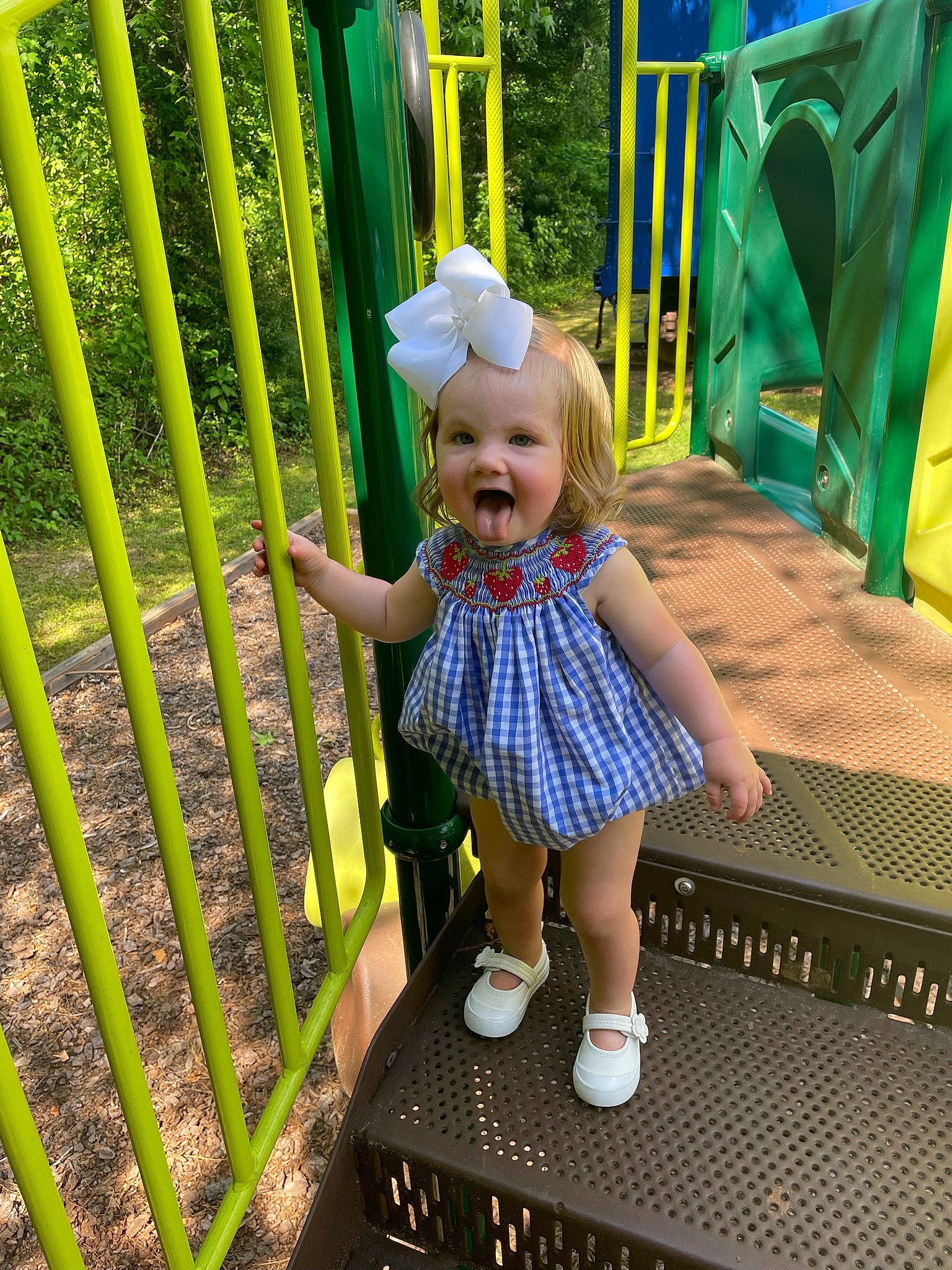 Avery joined the competition — help win amazing prizes! baby, baby_toddler_clothing, botany, fence, fun, grass, green, leaf, leisure, line, nature, person, photograph, plant, playground, product, recreation, smile, snapshot, toddler