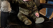 Oliver joined the competition — help win amazing prizes! adult, armchair, baby, blue_eyes, camouflage, child, curly_hair, furniture, home, indoors, infant, leather, living_room, onesie, photography, portrait, recliner, seated, sitting, wide_eyed