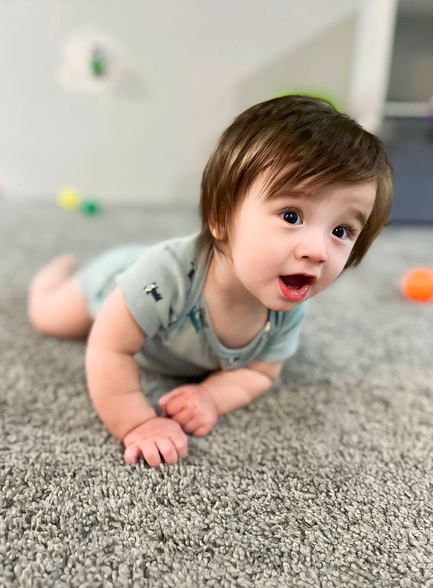 Max is registered to the contest to win money with this photo: baby, baby_toddler_clothing, cheek, child, crawling, eye, flash_photography, floor, flooring, grass, hair, happy, hardwood, head, nose, person, sitting, skin, sleeve, surprise