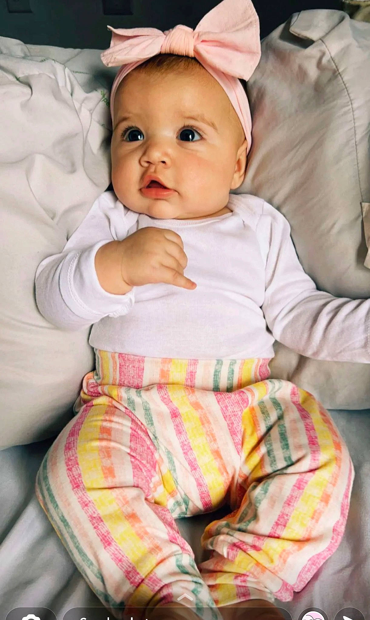 Alaia joined the competition — help win amazing prizes! baby, baby_toddler_clothing, cap, cheek, child, comfort, eye, face, fashion_accessory, green, happy, linens, magenta, pattern, person, pink, sitting, skin, sleeve, toddler