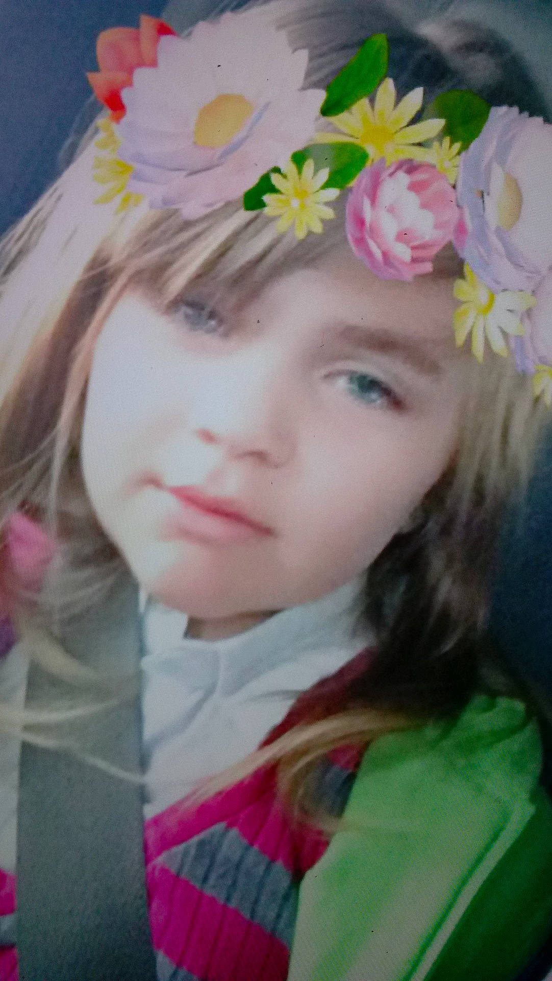Peyton is registered to the contest to win money with this photo: beauty, brown_hair, cheek, child, eye, face, flower, forehead, girl, hair_accessory, head, human_hair_color, iris, person, petal, pink, skin, toddler