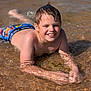 Eusébio a rejoint le concours — aidez-le/la à gagner de superbes lots ! boy, child, closeup, daytime, fun, happy, nature, outdoor, person, playful, recreation, relaxation, shallow_water, skin, smile, summer, sunlight, swimming_trunks, water, wet_hair