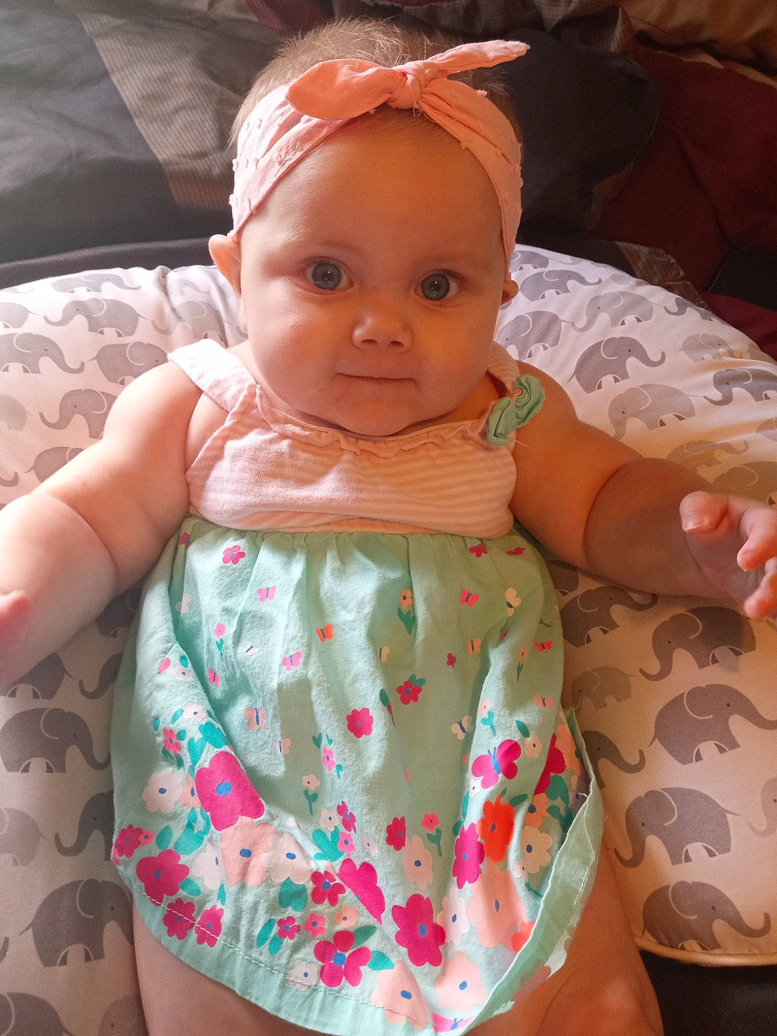 Aleah is registered to the contest to win money with this photo: arm, baby, baby_toddler_clothing, cheek, child, comfort, dress, finger, hand, head, headgear, human_body, organ, person, pink, product, skin, sleeve, textile, thigh