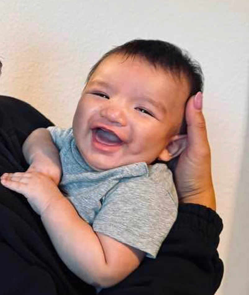 Amari Rey joined the competition — help win amazing prizes! baby, child, smiling, happy, face, person, infant, cute, holding, grey_shirt, hand, portrait, human, skin, cheerful, young, indoors, head, expression, joy