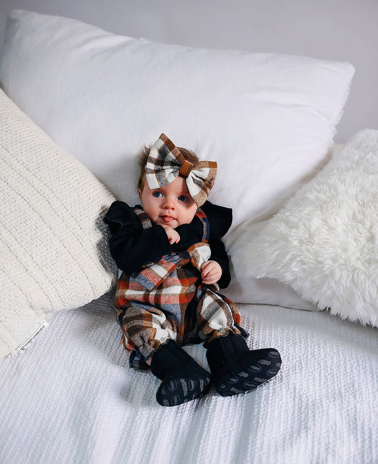 Lainey joined the competition — help win amazing prizes! baby_toddler_clothing, bed, bed_sheet, bedding, comfort, costume_hat, doll, fictional_character, flooring, fur, headwear, linens, pattern, person, pillow, room, sitting, sleeve, stuffed_toy, textile