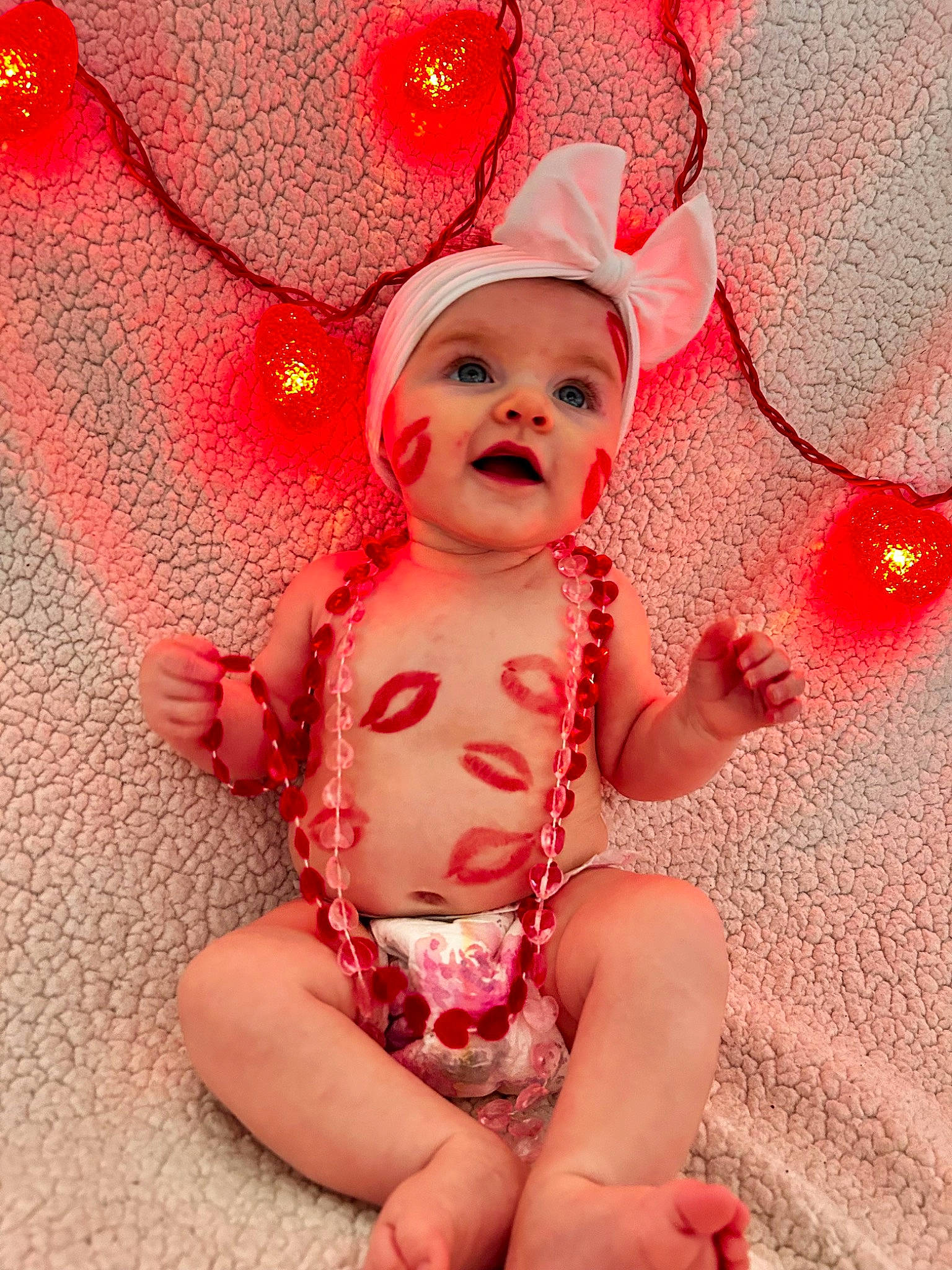 Lainey joined the competition — help win amazing prizes! baby, baby_sleeping, baby_toddler_clothing, cap, carmine, costume_hat, fashion_accessory, finger, flesh, foot, happy, head, holiday, human_leg, pattern, person, pink, red, thigh, thumb