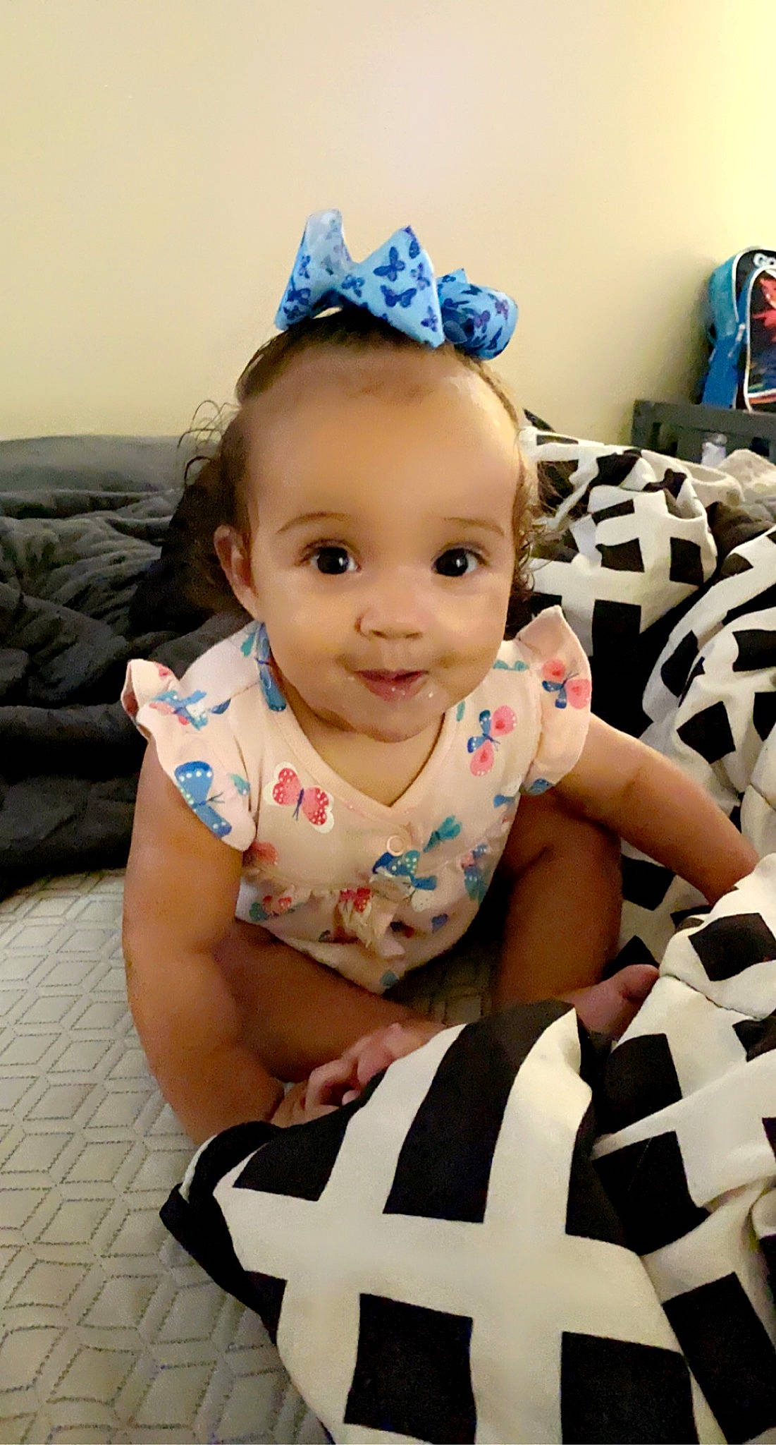 Zamyah is registered to the contest to win money with this photo: baby, baby_products, baby_toddler_clothing, blue, cap, cheek, child, eye, finger, flooring, fun, happy, hat, headgear, joy, person, skin, sleeve, smile, textile