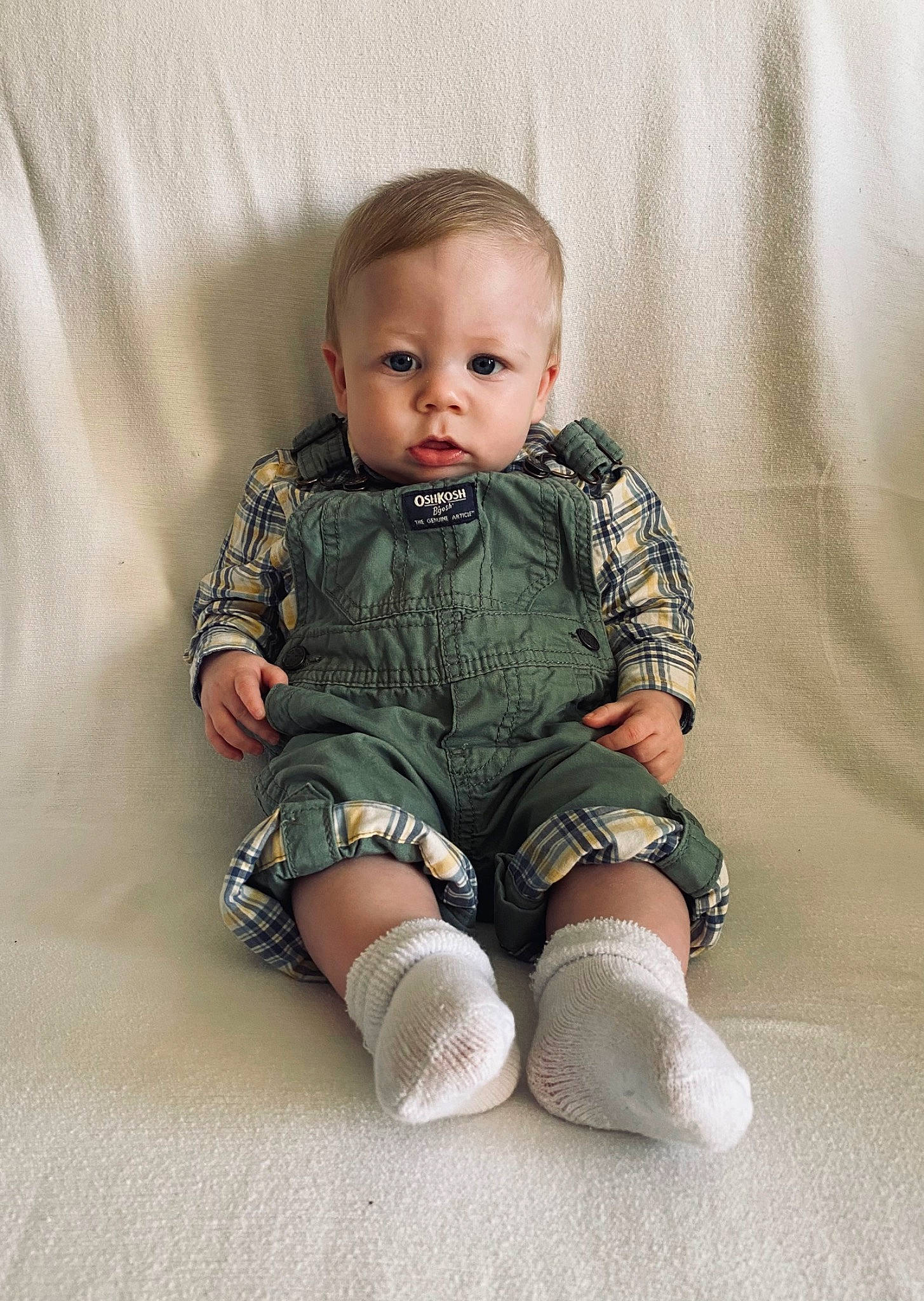 Waylon is registered to the contest to win money with this photo: baby, baby_toddler_clothing, cheek, child, collar, comfort, dress_shirt, face, flash_photography, head, human_body, iris, pattern, person, product, sitting, skin, sleeve, sock, t_shirt