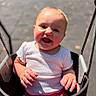 Oaklynn joined the competition — help win amazing prizes! baby, child, infant, stroller, smiling, laughing, outdoor, portrait, sunlight, daylight, seated, pink_clothing, white_shirt, happy, face, hands, eyes, walkway, photography, family