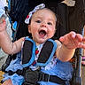 Oaklynn joined the competition — help win amazing prizes! baby, child, infant, smiling, happy, portrait, stroller, sitting, outdoor, blue_tutu, dress, bow, headband, harness, safety_belt, reaching, open_mouth, playful, sunlight, photography