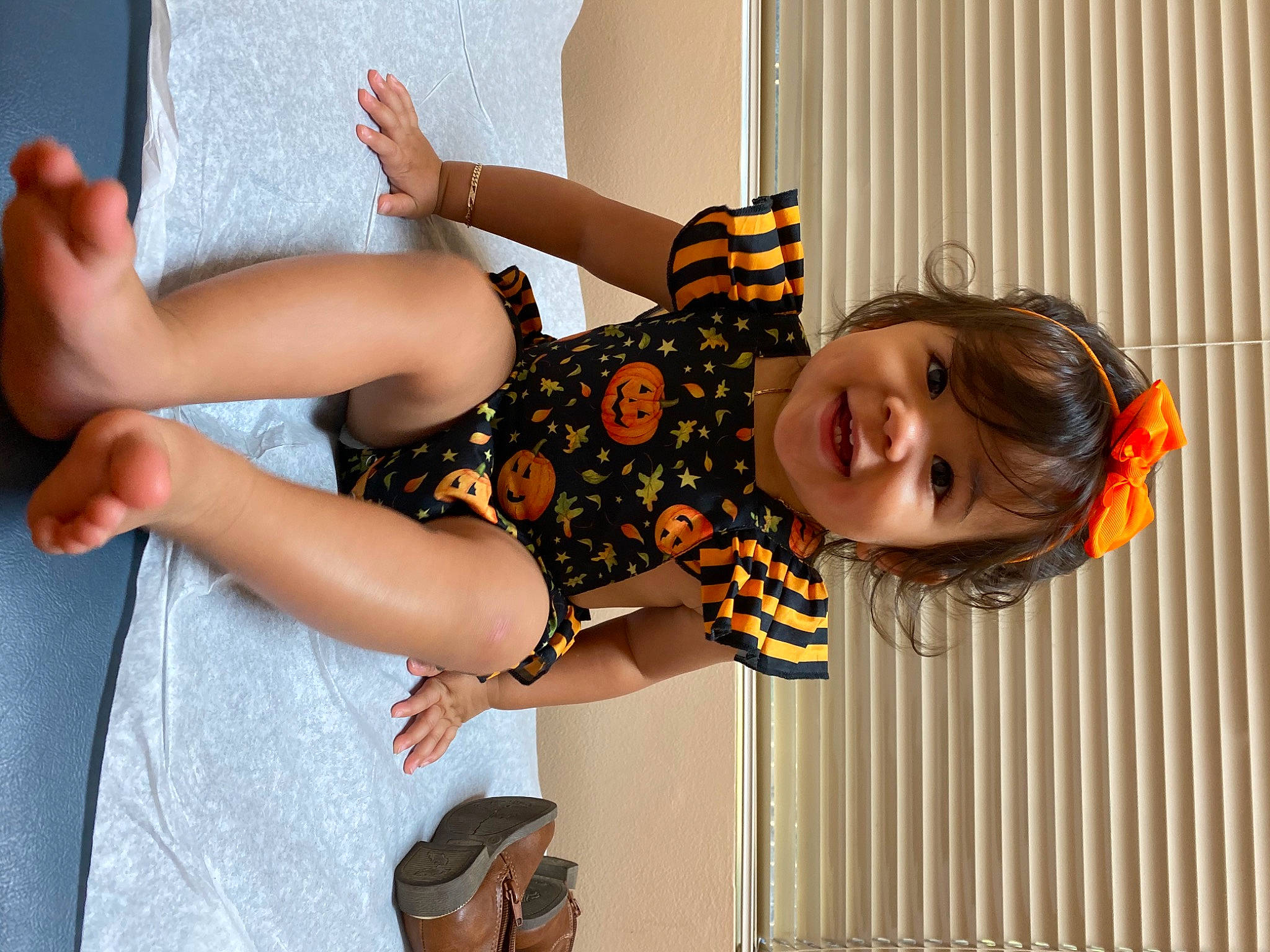 Emmaline joined the competition — help win amazing prizes! arm, baby_toddler_clothing, dress, elbow, fun, gesture, hairstyle, hand, happy, human_body, joint, joy, orange, pattern, person, smile, standing, thigh, toddler, waist