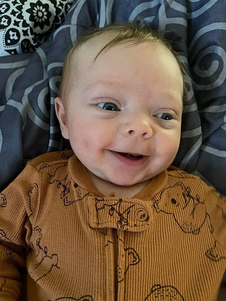 Rhett is registered to the contest to win money with this photo: baby, baby_toddler_clothing, cheek, chin, eye, eyebrow, face, forehead, hairstyle, happy, head, human_body, iris, mouth, nose, person, product, skin, sleeve, smile