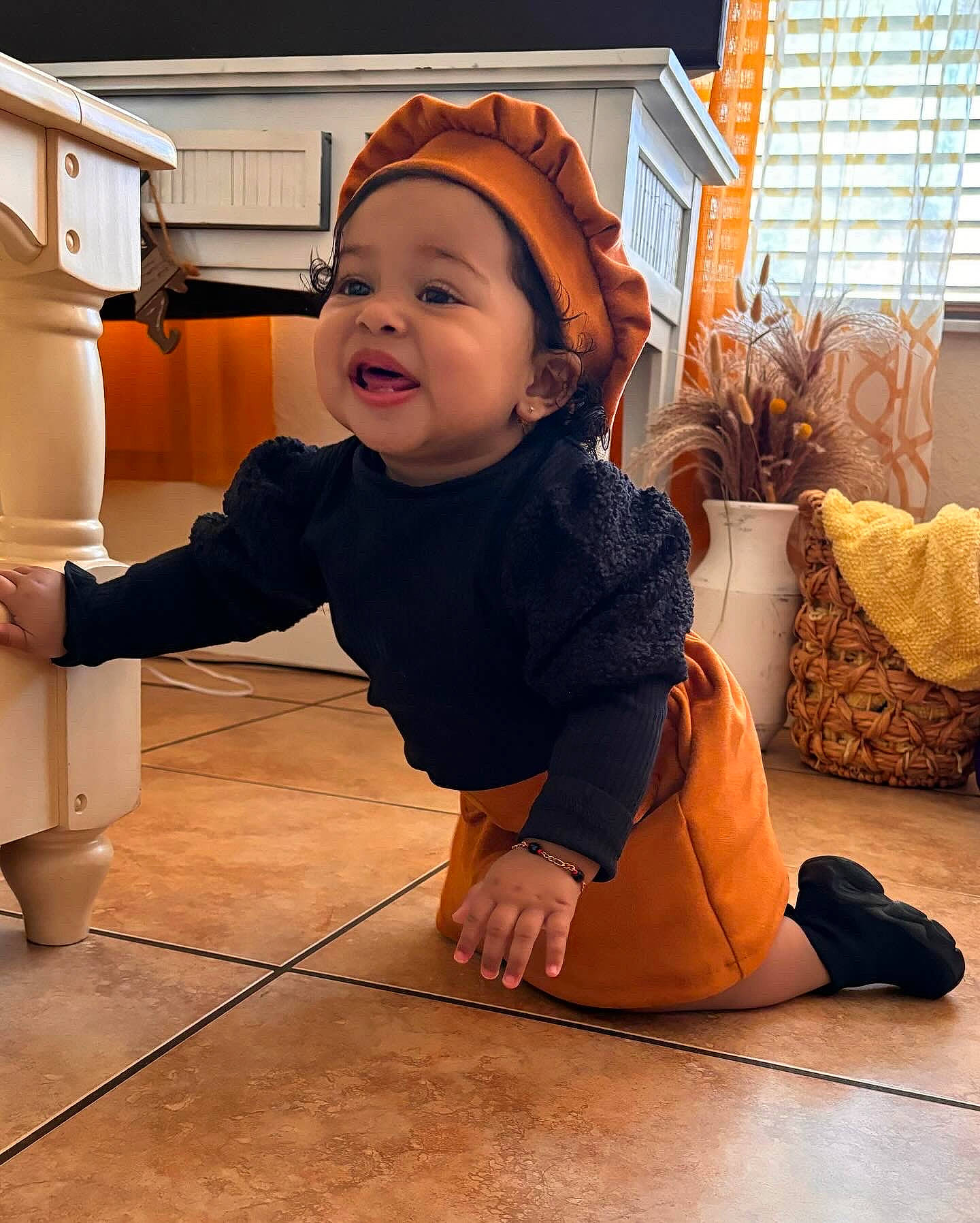 Skarlett is registered to the contest to win money with this photo: baby, baby_toddler_clothing, brown, child, comfort, floor, flooring, fun, happy, hardwood, headwear, houseplant, person, plant, room, sleeve, smile, toddler, window, window_blind