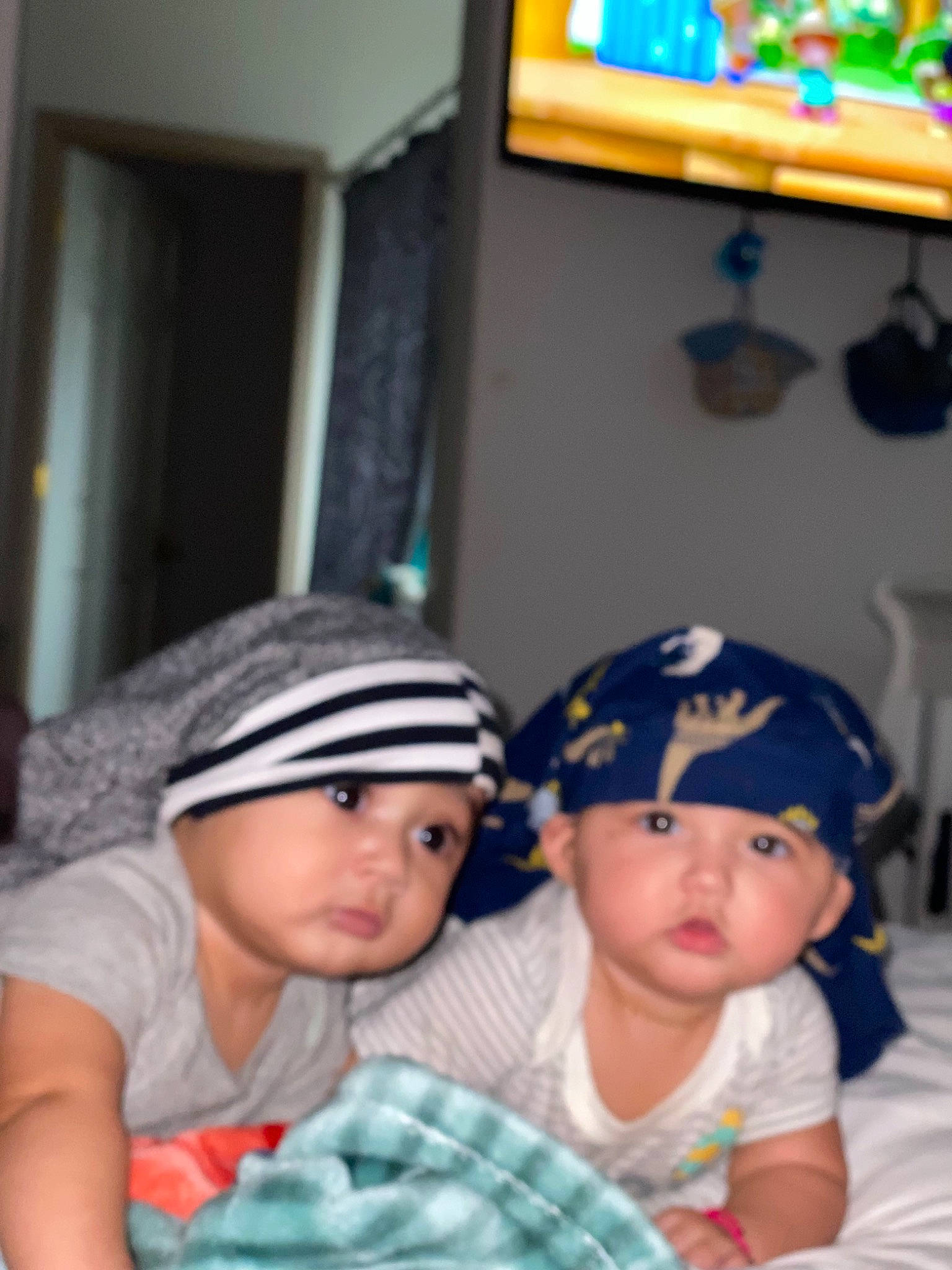 Dani joined the competition — help win amazing prizes! baby, baby_toddler_clothing, beanie, blue, cap, child, comfort, curtain, fun, happy, headwear, leisure, pattern, person, picture_frame, play, room, sitting, t_shirt, toddler