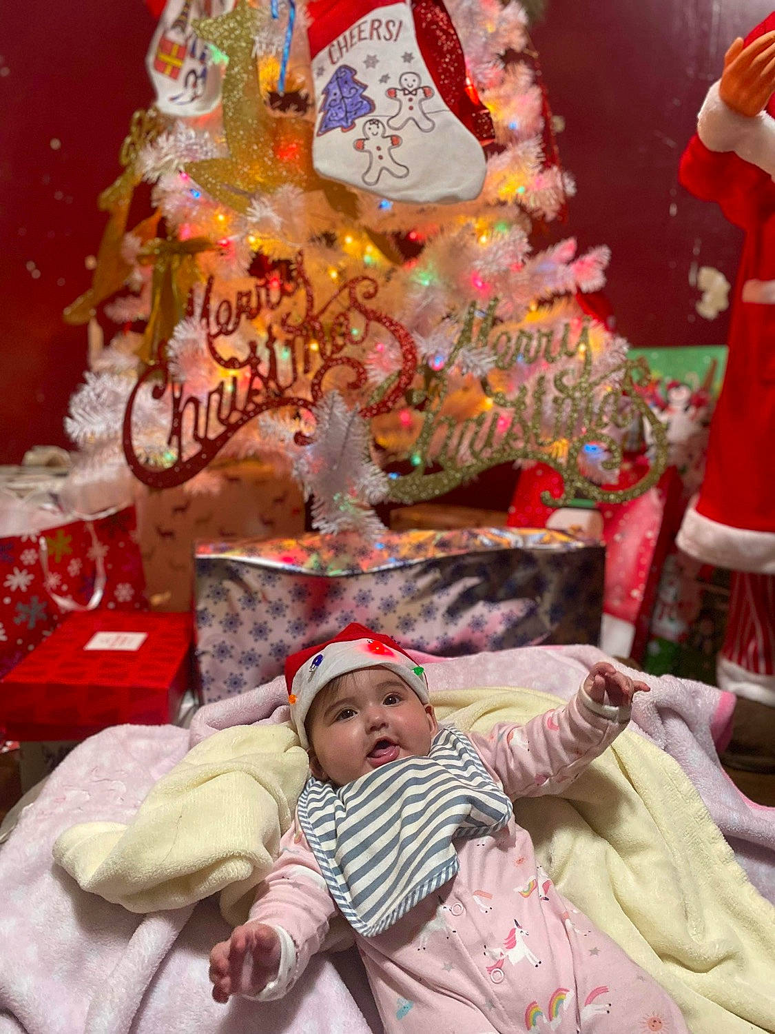 Melanie joined the competition — help win amazing prizes! baby, child, christmas, christmas_decoration, christmas_eve, christmas_ornament, comfort, decoration, event, fun, headwear, holiday, linens, ornament, person, pink, room, snapshot, temple, textile