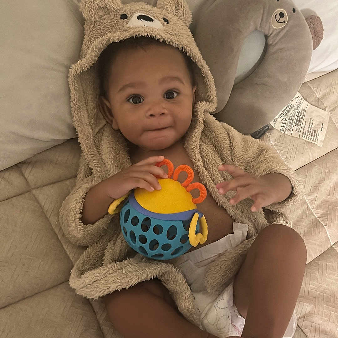 Ma'Kai joined the competition — help win amazing prizes! baby, bed, child, comfort, cute, diaper, face, feet, hands, hoodie, indoor, infant, pillow, playful, plush, quilt, relaxing, smiling, soft, toy