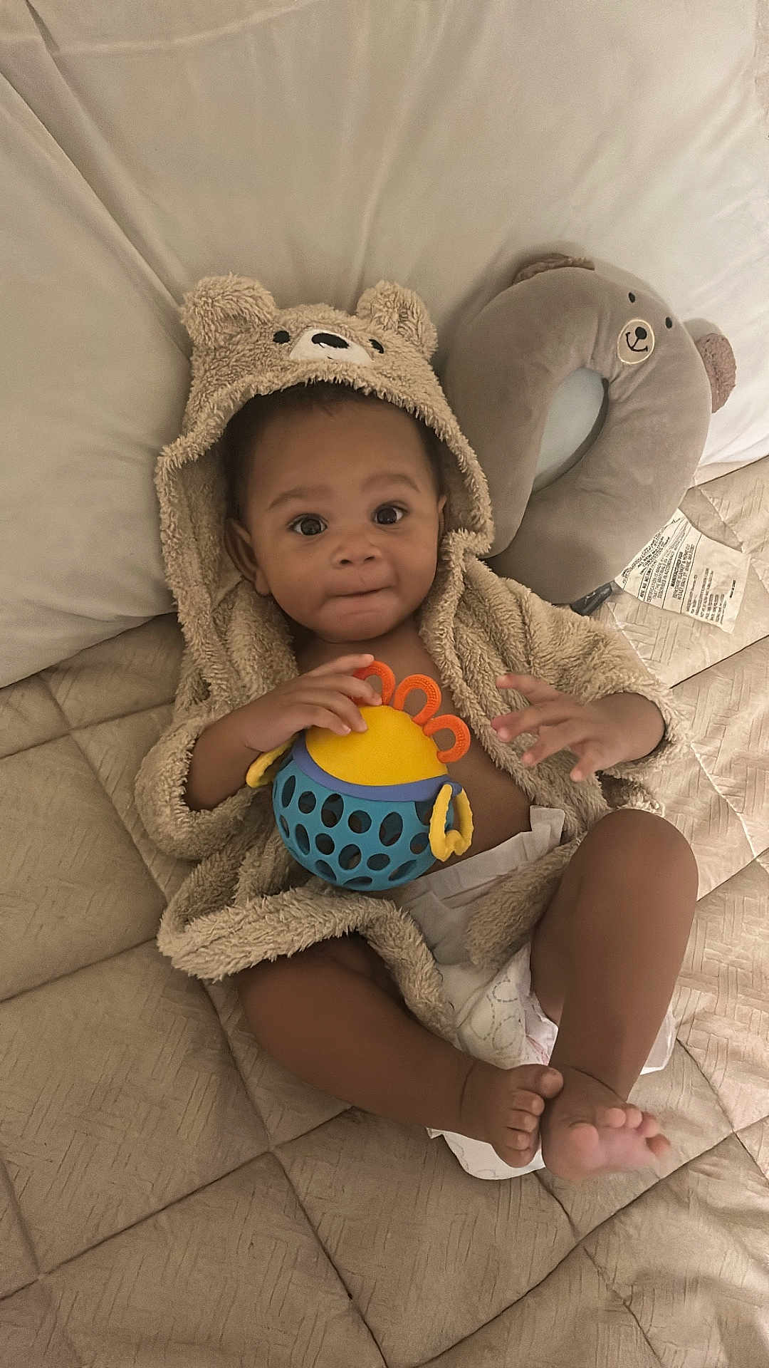 Ma'Kai joined the competition — help win amazing prizes! baby, child, hoodie, plush, toy, diaper, bed, pillow, quilt, face, hands, feet, cute, indoor, relaxing, soft, comfort, playful, smiling, infant