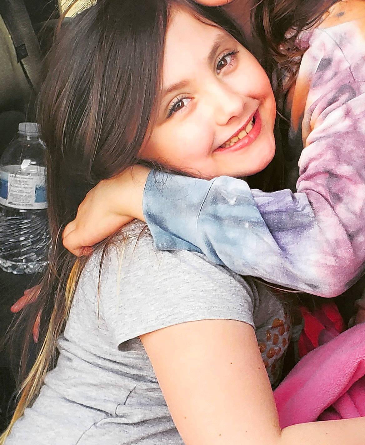 Nora is registered to the contest to win money with this photo: bottle, bottled_water, comfort, drinking_water, eye, flash_photography, gesture, hair, hairstyle, happy, human_body, joy, mineral_water, mouth, muscle, person, shorts, shoulder, skin, smile