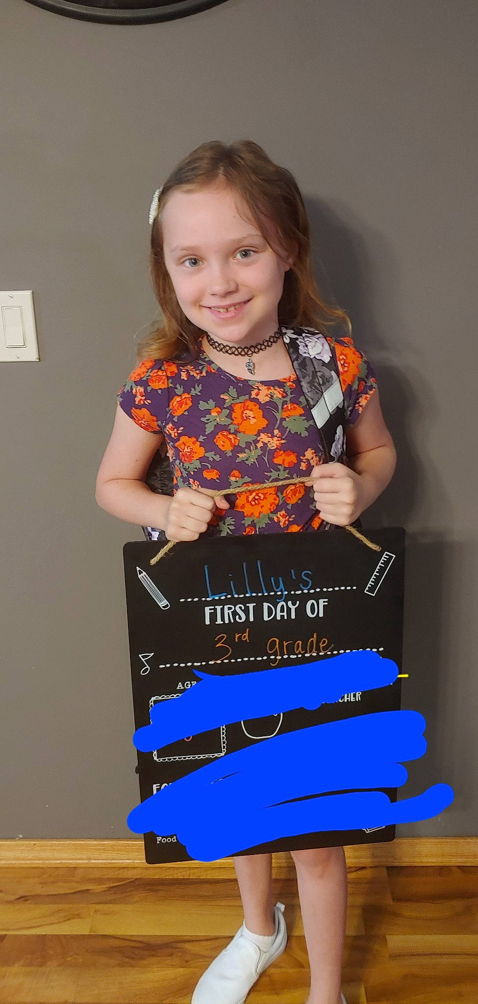 Lilly is registered to the contest to win money with this photo: advertising, box, child, child_model, electric_blue, event, font, fun, hair, happy, joy, pattern, person, play, room, sitting, sleeve, smile, t_shirt, toddler