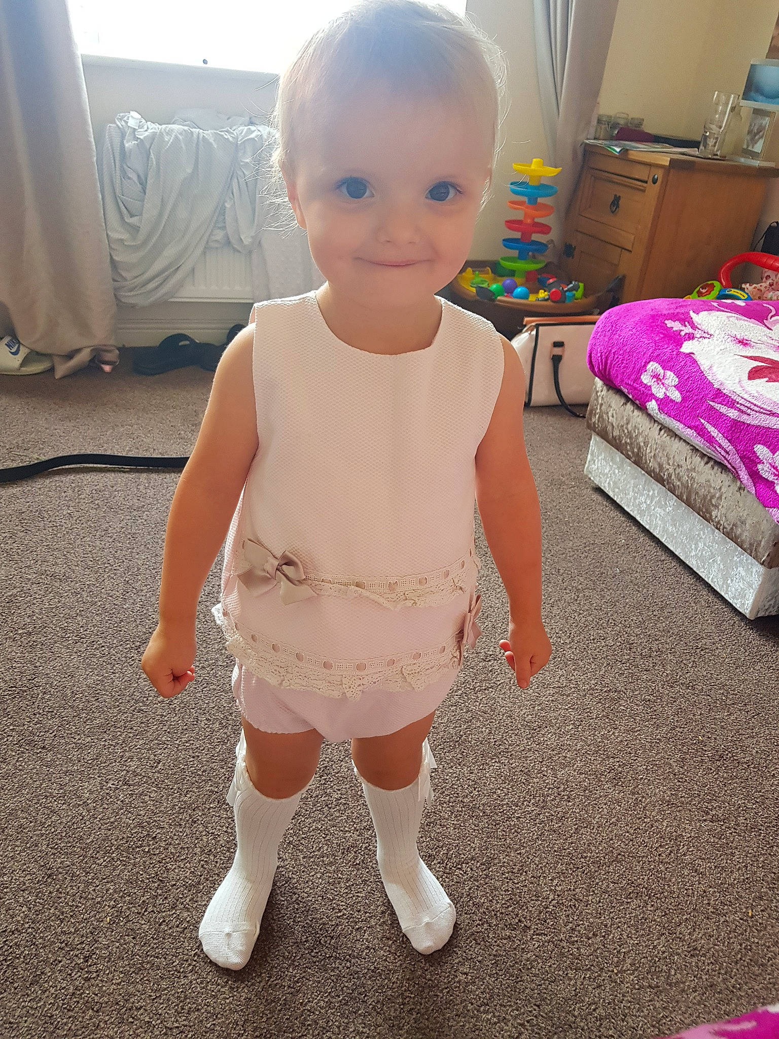 Rorosanna-mae  is registered to the contest to win money with this photo: baby, cheek, child, dress, floor, head, joint, joy, knee, leg, person, pink, shoe, skin, standing, toddler, toy