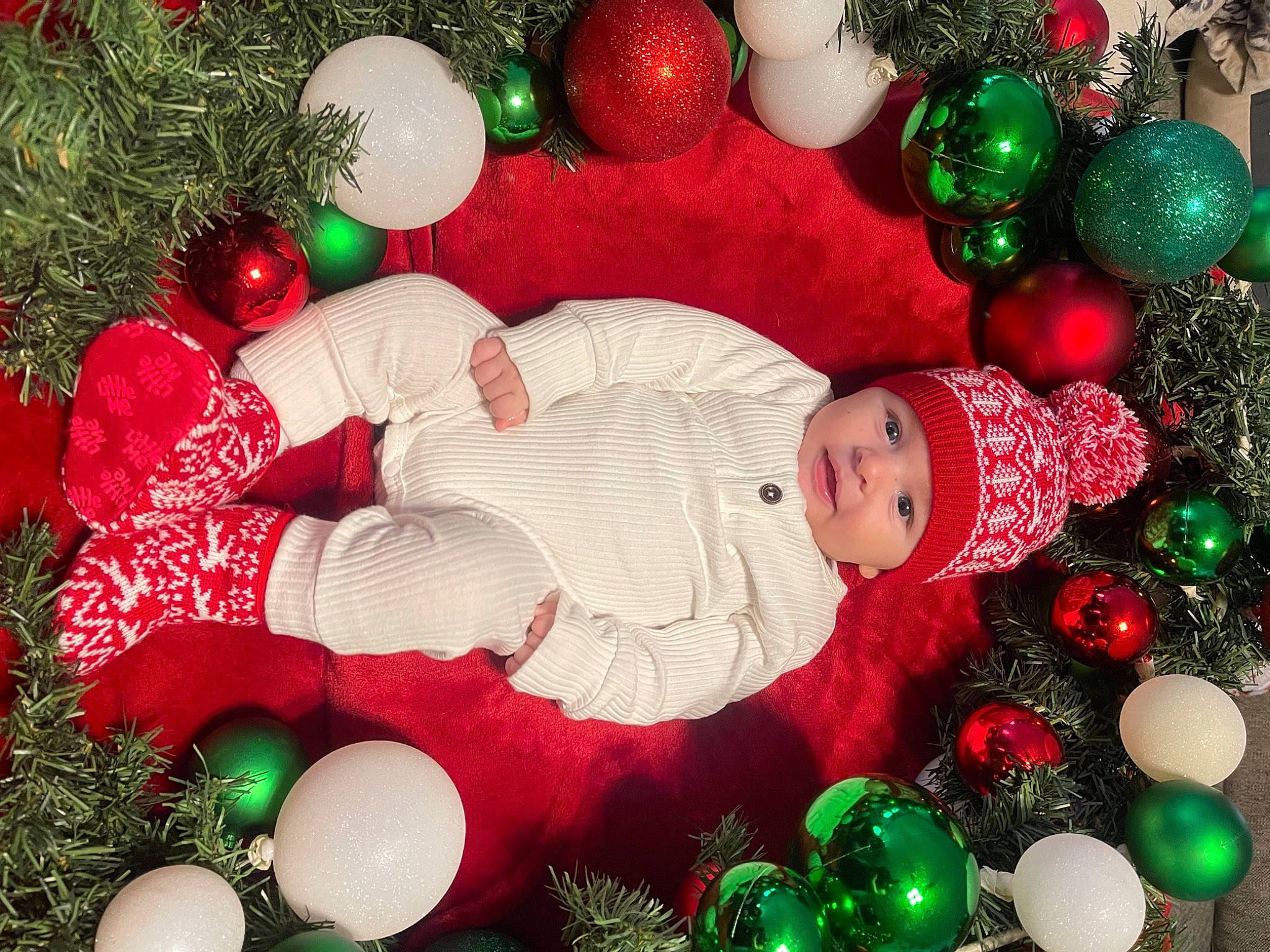 Lincoln is registered to the contest to win money with this photo: christmas, christmas_decoration, christmas_eve, christmas_ornament, christmas_tree, decoration, event, evergreen, green, happy, headwear, holiday, holiday_ornament, light, lighting, ornament, person, plant, red, toddler