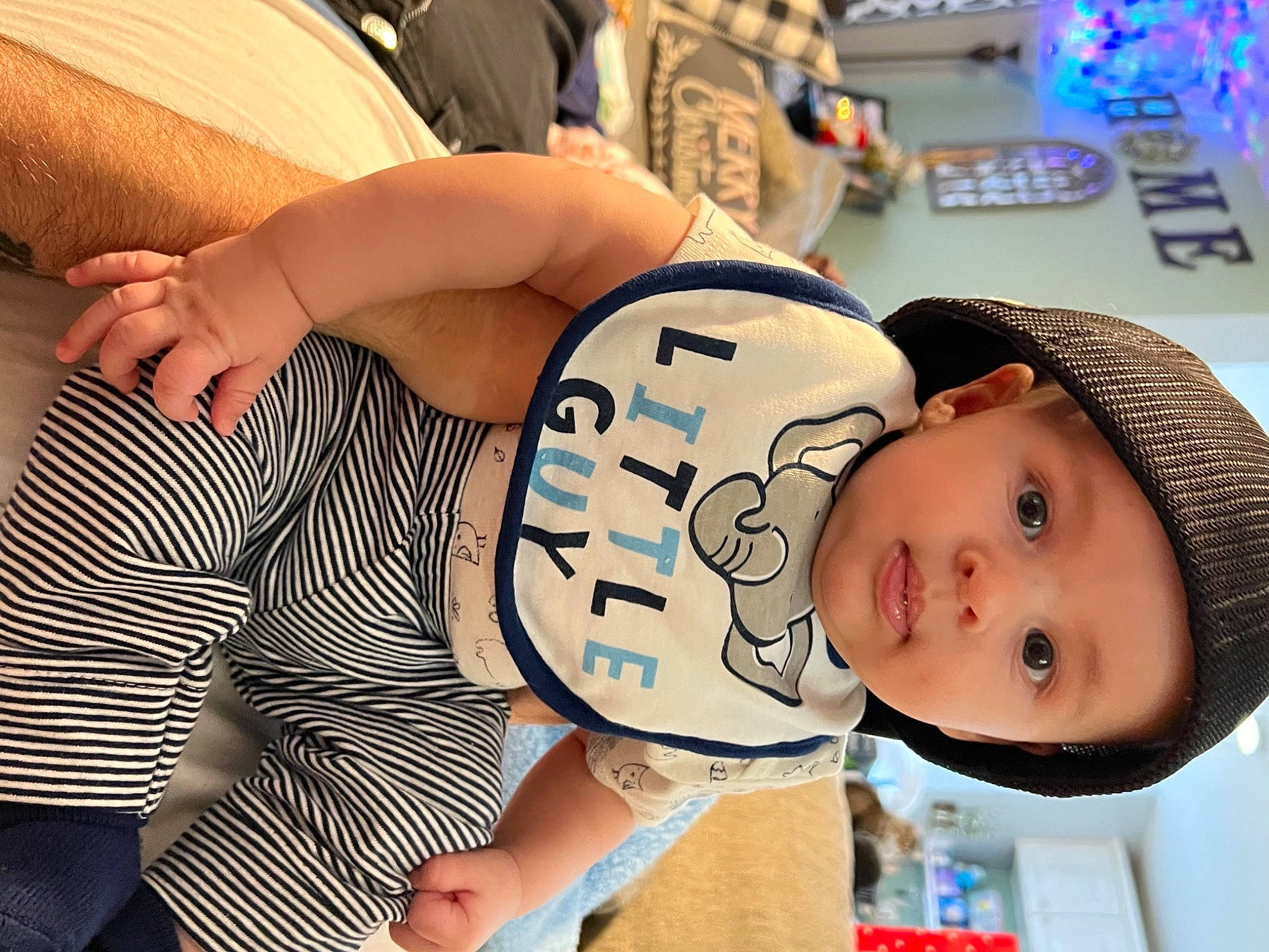 Lincoln is registered to the contest to win money with this photo: abdomen, baby, baby_products, baby_safety, baby_toddler_clothing, cheek, chest, child, comfort, elbow, eyelash, fun, happy, headwear, human_leg, leisure, mouth, pattern, person, sitting