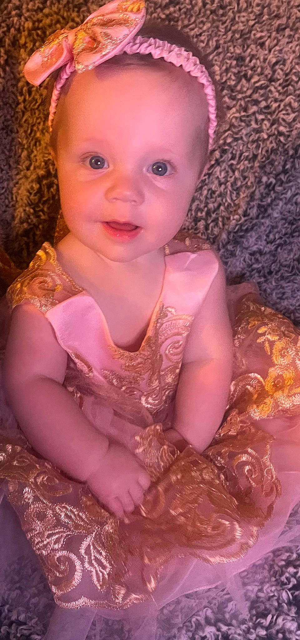 Gwendolyn is registered to the contest to win money with this photo: baby, baby_toddler_clothing, blond, cheek, child, day_dress, dress, embellishment, eye, face, happy, head, iris, lip, magenta, person, pink, purple, skin, smile
