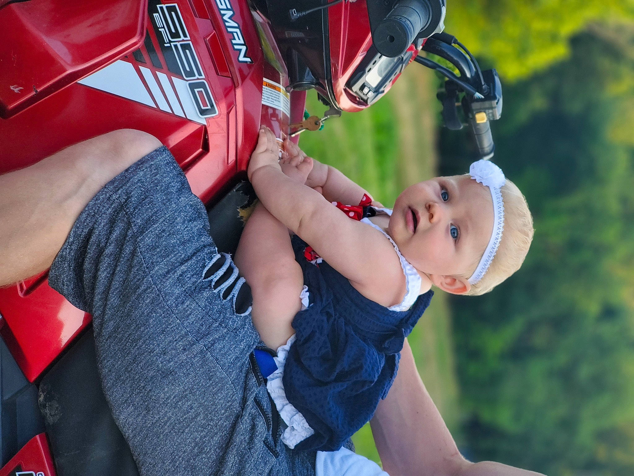 Gabriella is registered to the contest to win money with this photo: bicycle_helmet, child, competition_event, electric_blue, fun, glove, grass, happy, headwear, helmet, human_leg, leisure, person, personal_protective_equipment, recreation, shorts, sports_equipment, sports_gear, sports_uniform, sportswear