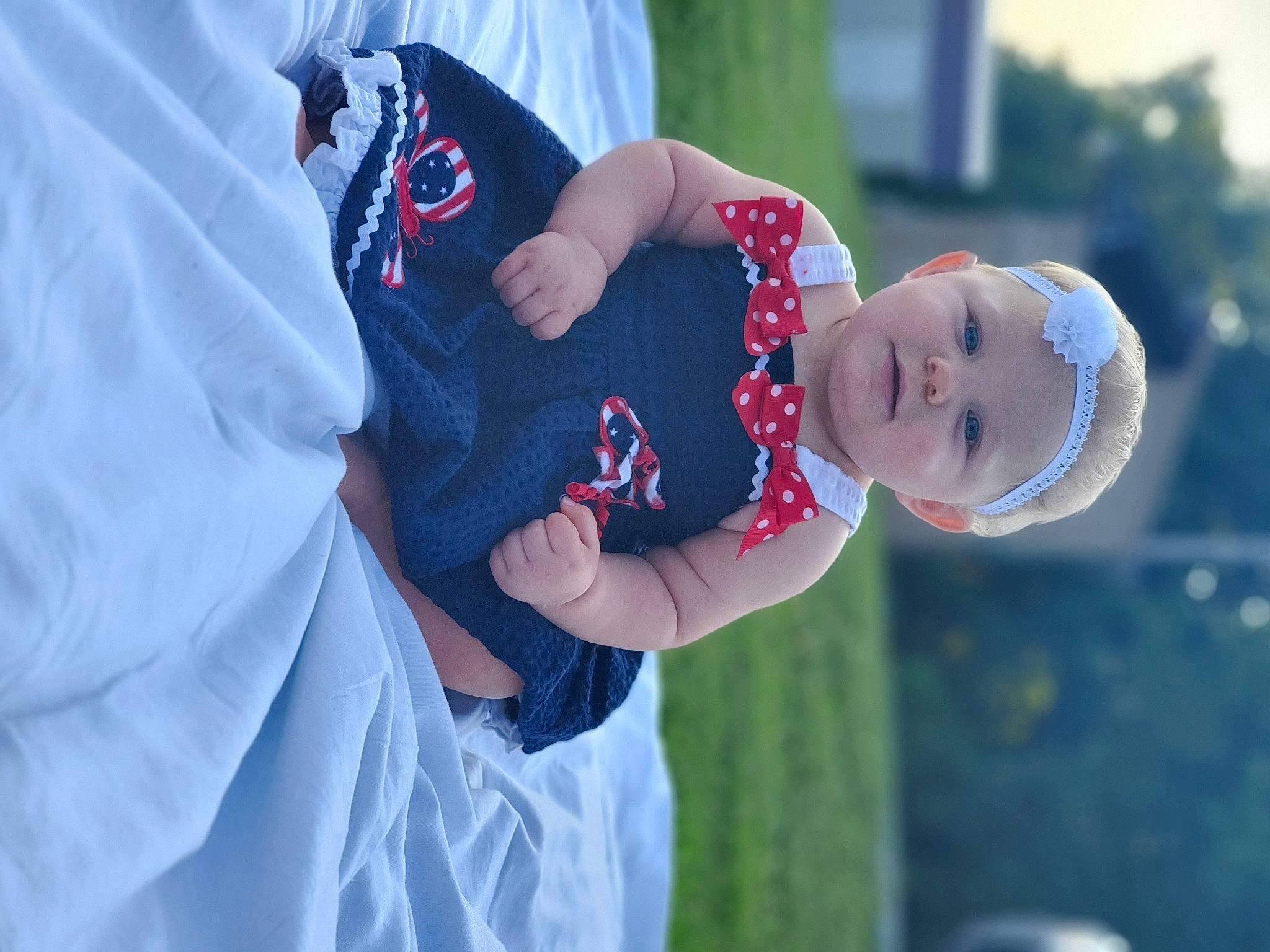 Gabriella is registered to the contest to win money with this photo: baby, child, electric_blue, event, flash_photography, fun, gesture, grass, hand, happy, hat, headwear, leisure, person, portrait_photography, recreation, sleeve, smile, t_shirt, toddler