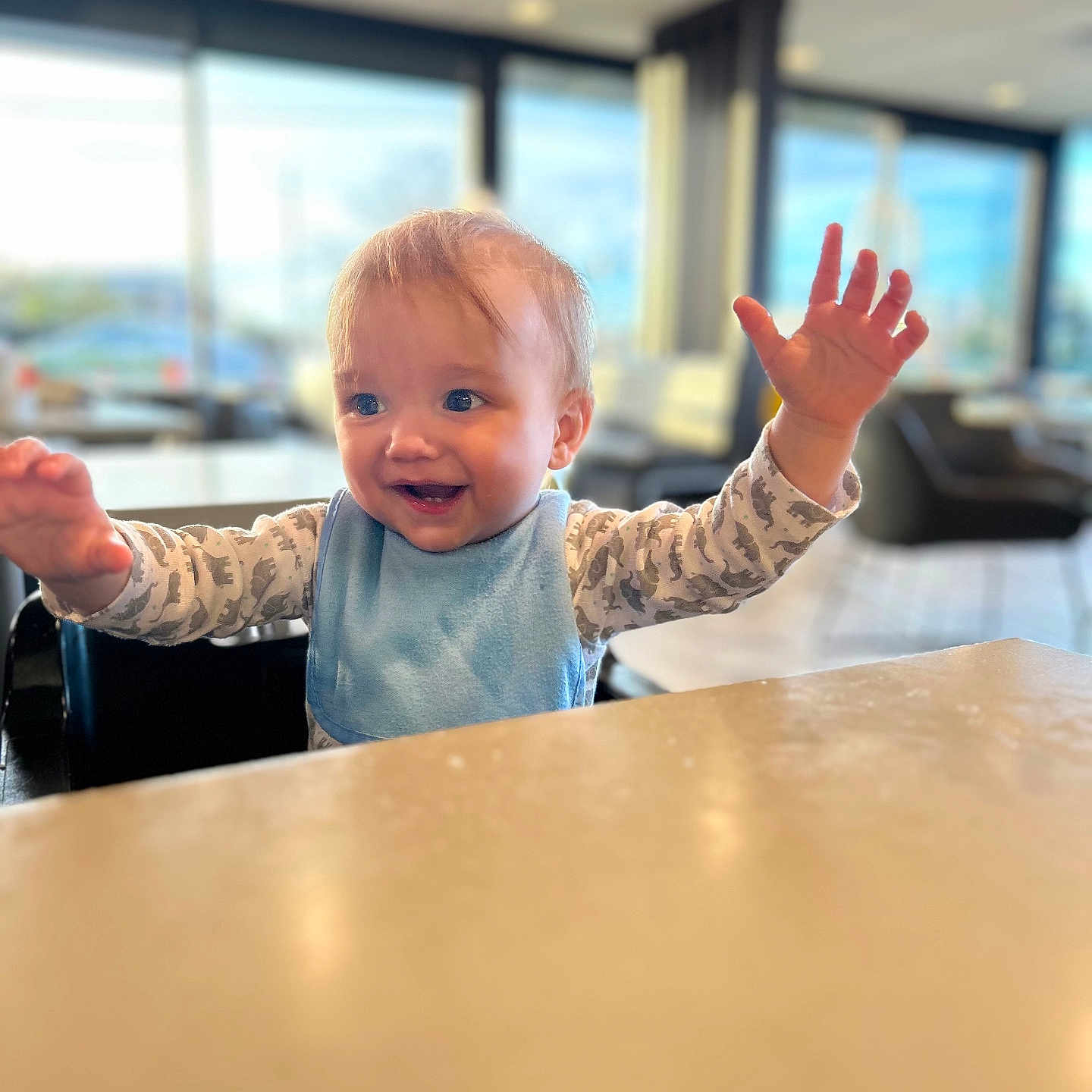 Henley joined the competition — help win amazing prizes! baby, bodypart, clothing, face, finger, furniture, hand, happy, head, indoors, interiordesign, person, photography, plywood, portrait, sitting, smile, table, tabletop, wood